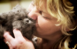 Cyndi-giving-Rudy-her-Selkirk-Rex-cat-kisses