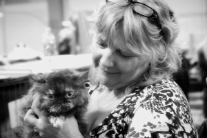 Black-and-White-photo-of-Cyndi-holding-Hannah-Montana-a-beautiful-chocolate-tortie-selkirk-rex-cat